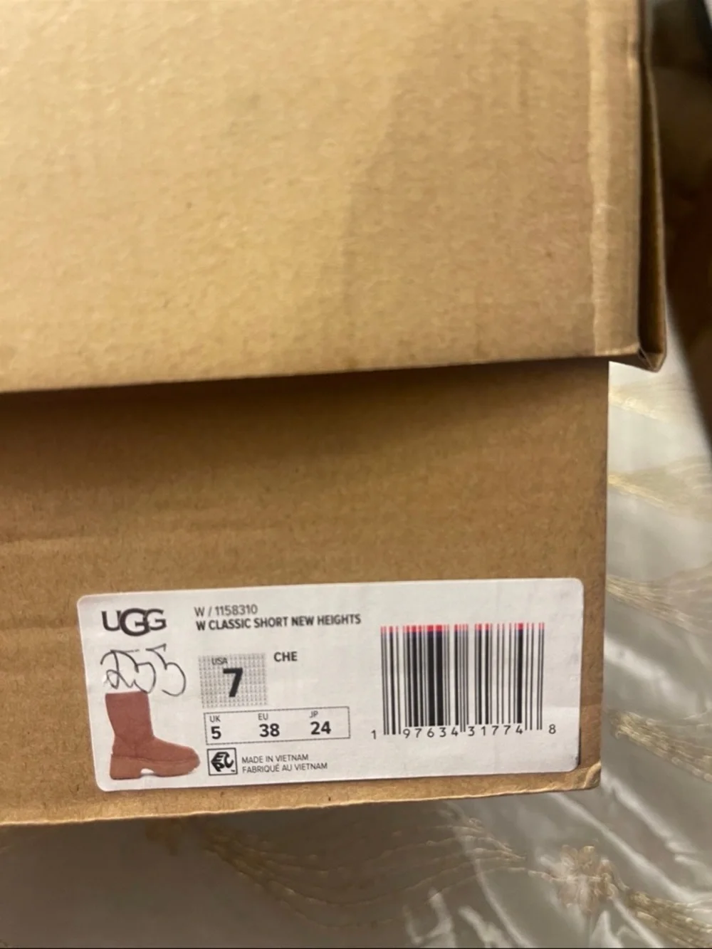UGG Women's classic short new heights bootie’s size 7